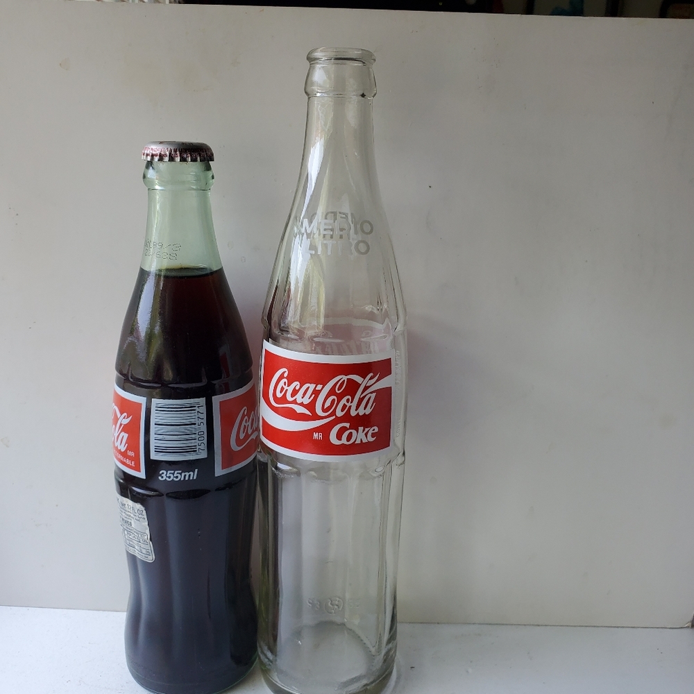 Coca Cola  2 bottles Made in Mexico 500 ml empty + 355 ml  unopened bottle.